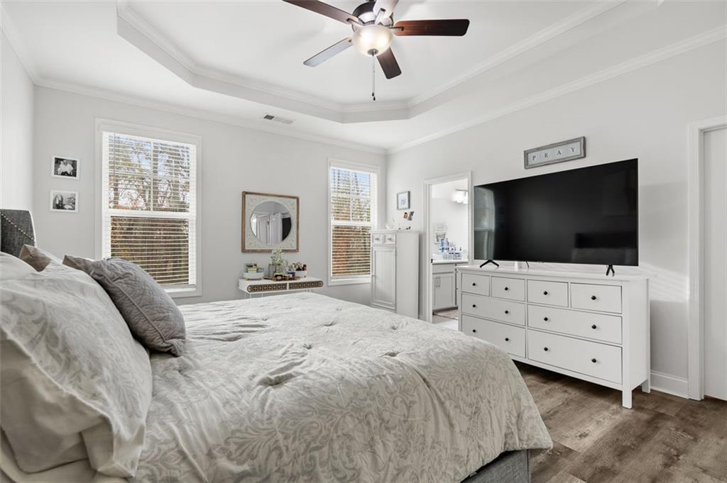 6176 Eves Way Norcross, GA 30071 - Photo 20 of 36 a bedroom with a large bed and flat tv