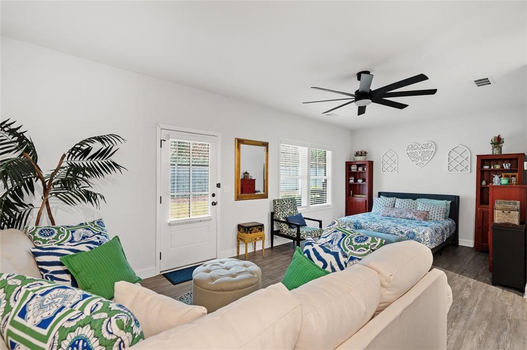 6176 Eves Way Norcross, GA 30071 - Photo 28 of 36 a living room with furniture and a window