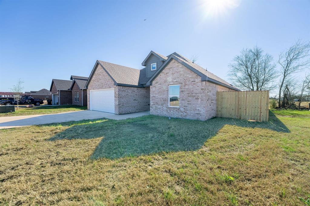 1032 Springview Lane Mabank, TX 75147 - Photo 2 of 15 a view of a house with a yard