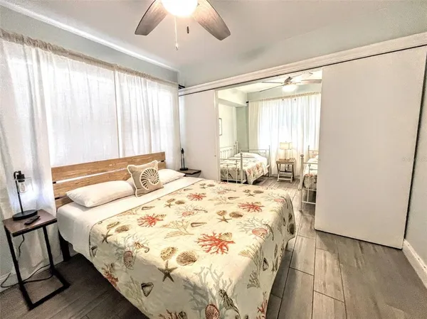 a bedroom with double bed and a window