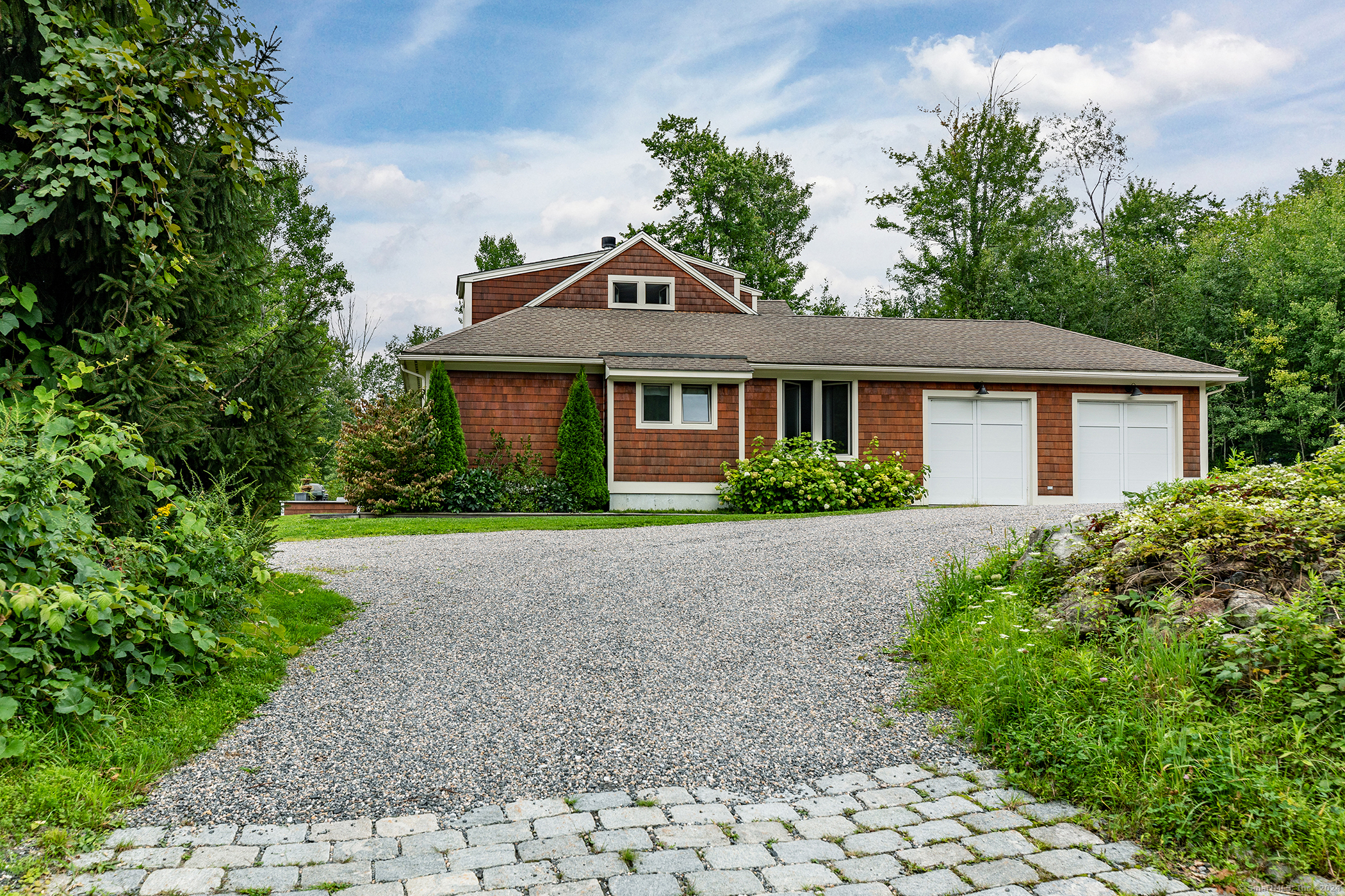 99 Town Hill Road Warren, CT 06754 - Photo 1 of 1 a front view of a house with a garden