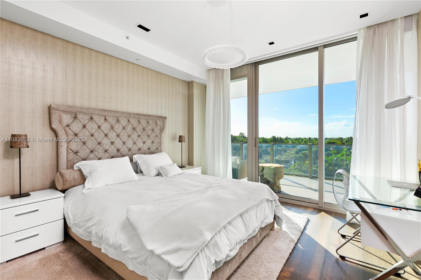 360 Ocean Drive, Unit 501S Key Biscayne, FL 33149 - Photo 21 of 40 a bedroom with a large bed and a large window