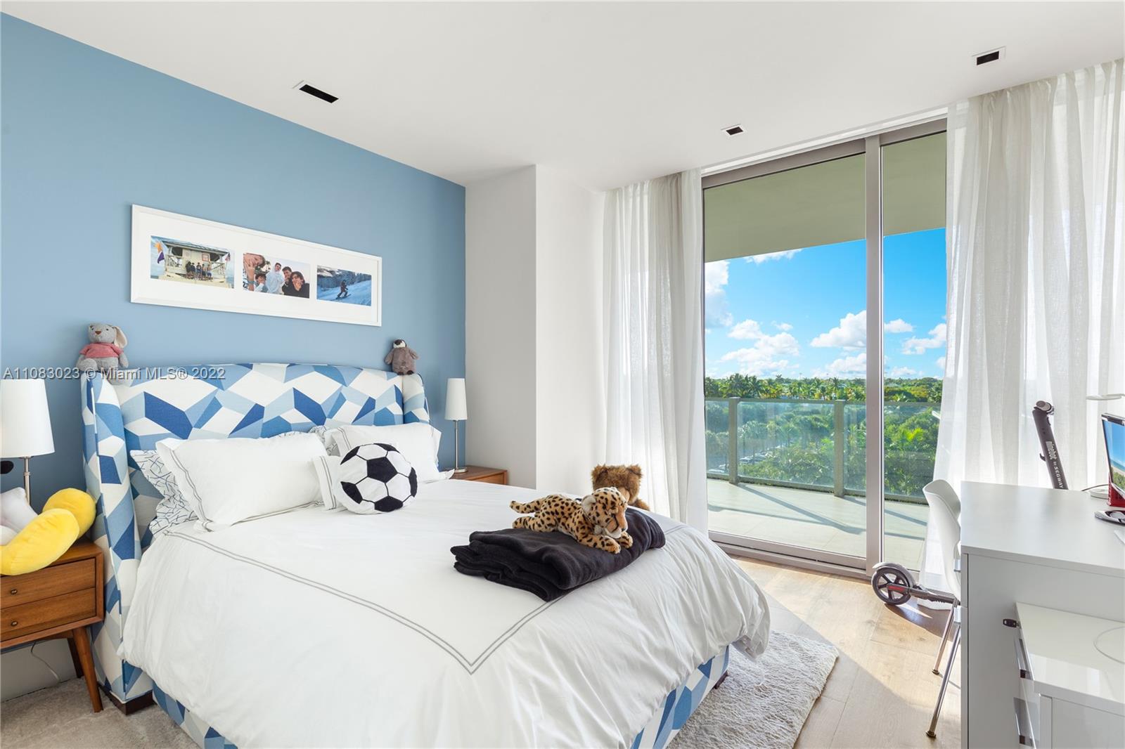 360 Ocean Drive, Unit 501S Key Biscayne, FL 33149 - Photo 24 of 40 a bedroom with a bed and a large window