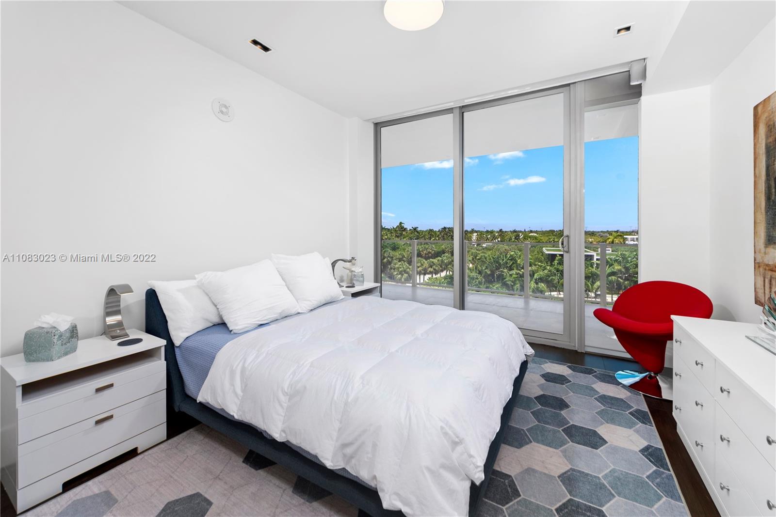 360 Ocean Drive, Unit 501S Key Biscayne, FL 33149 - Photo 26 of 40 a bed room with a bed and a window