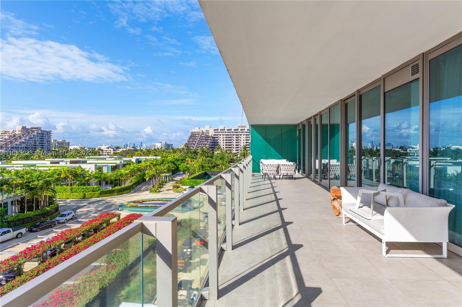 360 Ocean Drive, Unit 501S Key Biscayne, FL 33149 - Photo 28 of 40 a view of swimming pool with outdoor seating and plants