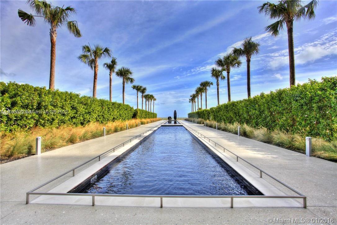 360 Ocean Drive, Unit 501S Key Biscayne, FL 33149 - Photo 31 of 40 a view of swimming pool with a yard and potted plants