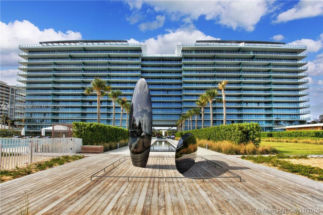 360 Ocean Drive, Unit 501S Key Biscayne, FL 33149 - Photo 32 of 40 a view of a balcony with dining table and chairs with wooden floor and plants