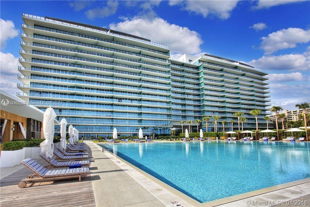 360 Ocean Drive, Unit 501S Key Biscayne, FL 33149 - Photo 34 of 40 a view of a swimming pool with a outdoor seating