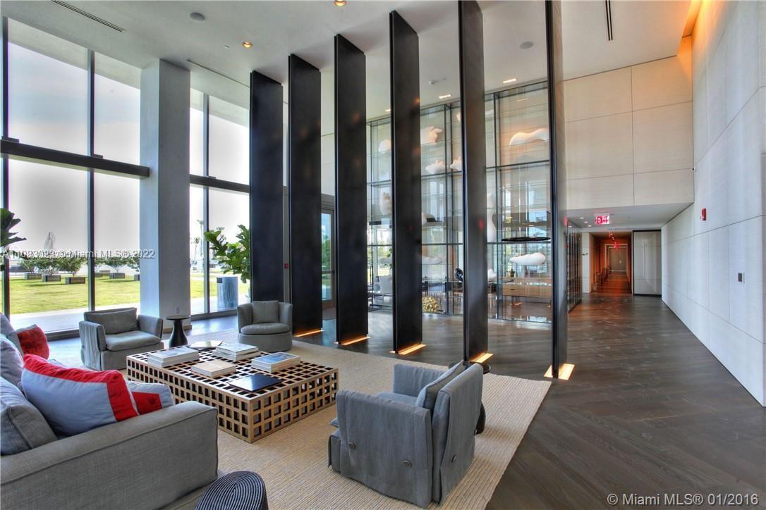 360 Ocean Drive, Unit 501S Key Biscayne, FL 33149 - Photo 36 of 40 a living room with furniture and a floor to ceiling window