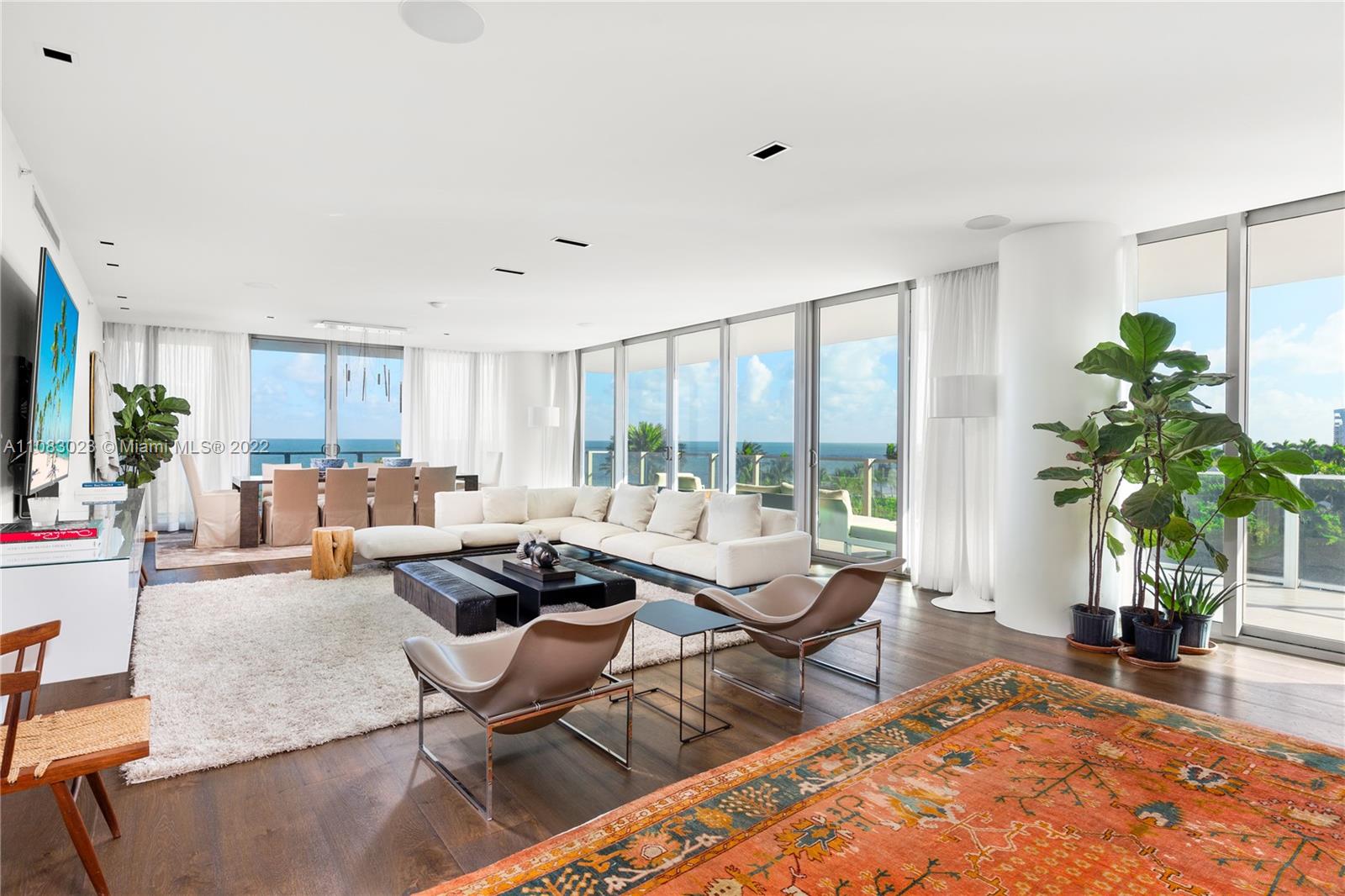 360 Ocean Drive, Unit 501S Key Biscayne, FL 33149 - Photo 7 of 40 a living room with furniture floor to ceiling window and potted plant
