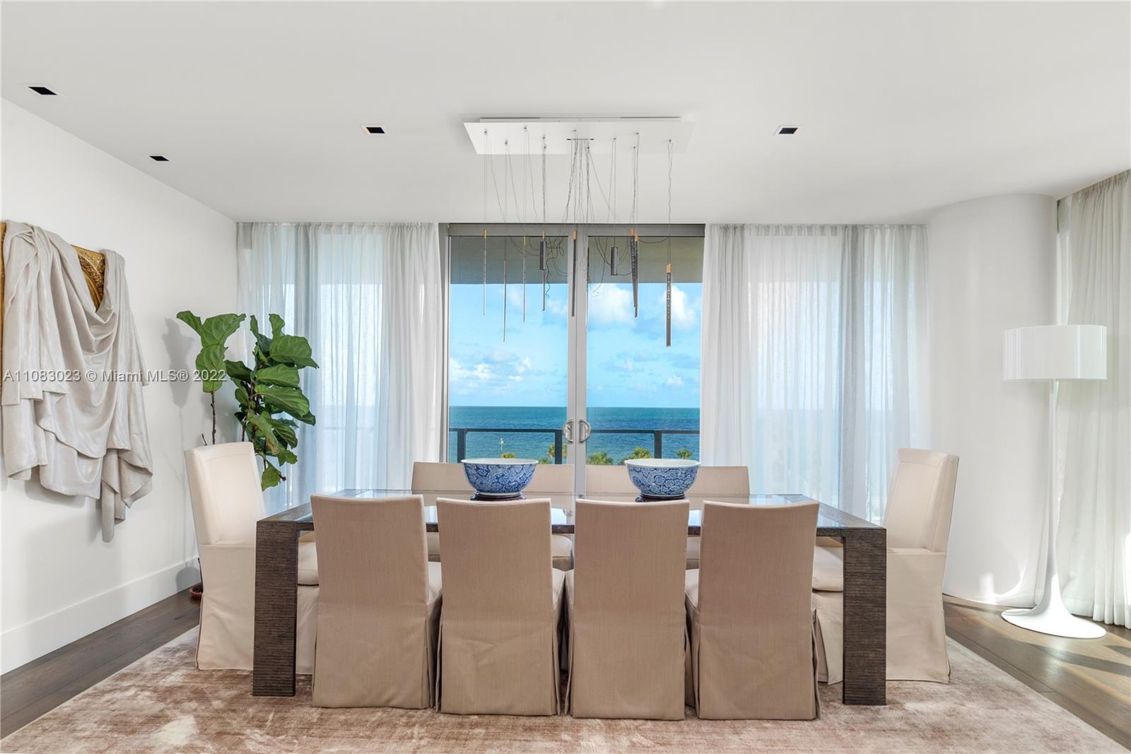 360 Ocean Drive, Unit 501S Key Biscayne, FL 33149 - Photo 8 of 40 a living room with large windows