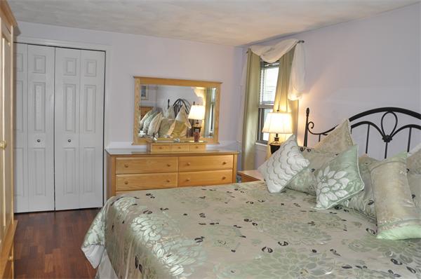 26 Mansfield Drive Wakefield, MA 01880 - Photo 11 of 26 a bedroom with a bed and a dresser