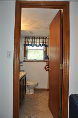 26 Mansfield Drive Wakefield, MA 01880 - Photo 20 of 26 a bathroom with a toilet a sink and a shower