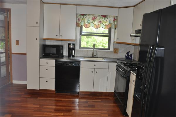 26 Mansfield Drive Wakefield, MA 01880 - Photo 2 of 26 a kitchen with a sink stove and refrigerator