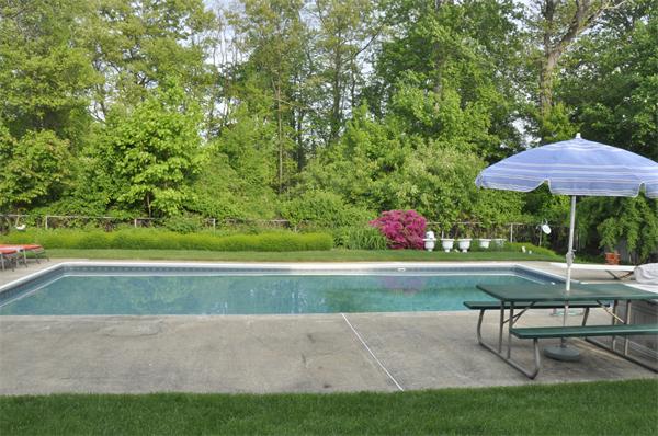 26 Mansfield Drive Wakefield, MA 01880 - Photo 23 of 26 a view of backyard with seating space and trees