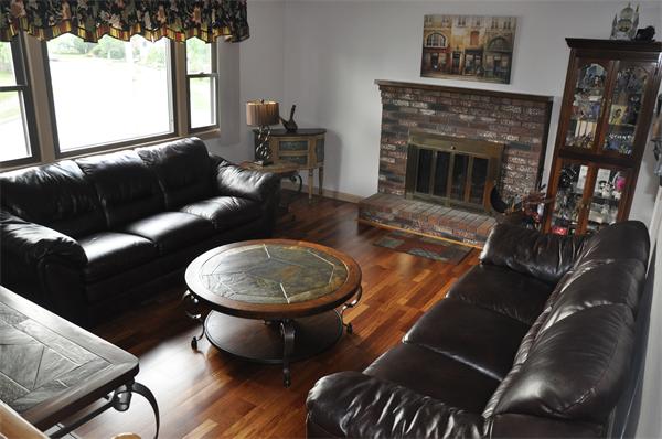 26 Mansfield Drive Wakefield, MA 01880 - Photo 4 of 26 a living room with furniture a fireplace and a large window