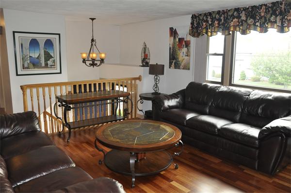 26 Mansfield Drive Wakefield, MA 01880 - Photo 5 of 26 a living room with furniture a window and a chandelier