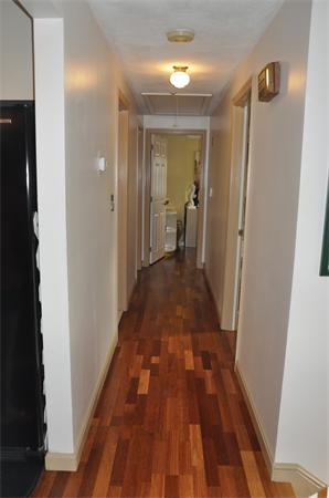 26 Mansfield Drive Wakefield, MA 01880 - Photo 8 of 26 a view of a hallway view with wooden floor and staircase