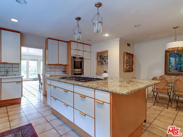 a spacious bedroom with a bed and a couch