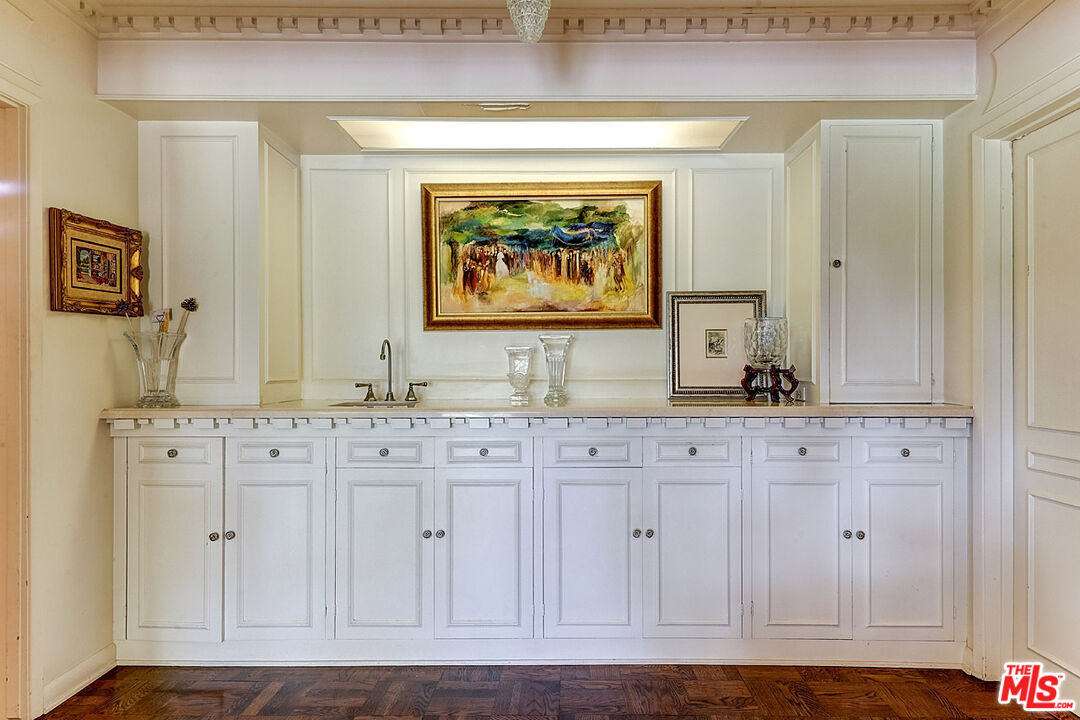 322 North June Street Los Angeles, CA 90004 - Photo 14 of 36 a view of a hallway with granite countertop white cabinets