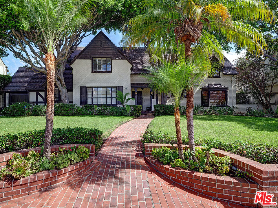 322 North June Street Los Angeles, CA 90004 - Photo 2 of 36 a front view of a house with a yard