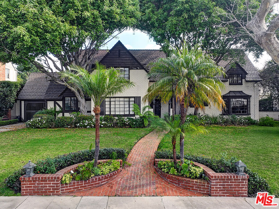 322 North June Street Los Angeles, CA 90004 - Photo 35 of 36 a front view of a house with a yard