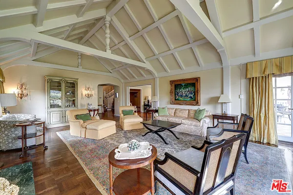 a living room with furniture and a table