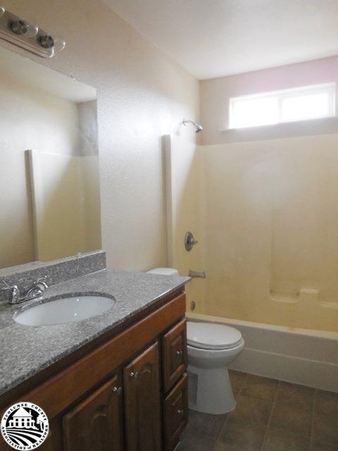 2093 Quail Hill Road Copperopolis, CA 95228 - Photo 9 of 14 a bathroom with a granite countertop sink toilet and shower
