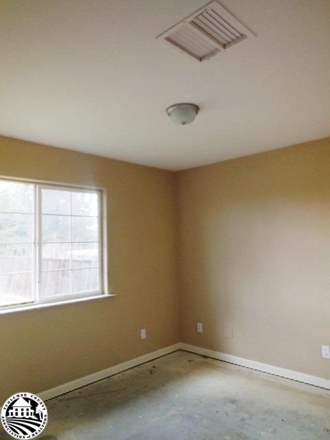 2093 Quail Hill Road Copperopolis, CA 95228 - Photo 10 of 14 an empty room with a window