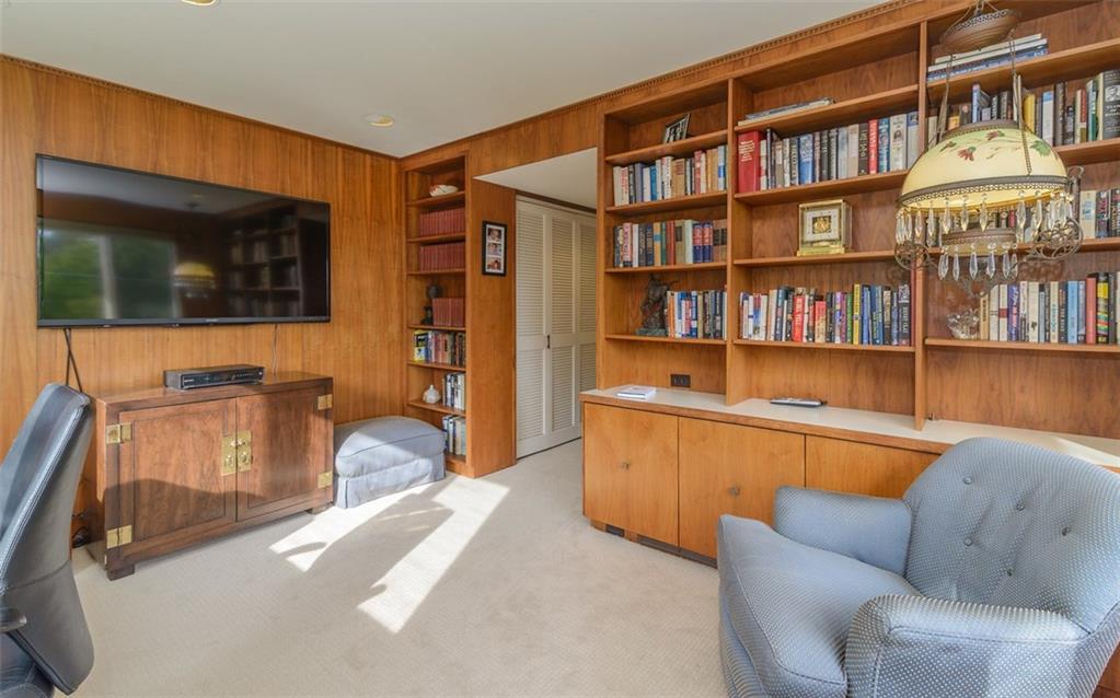 450 Backbone Road Sewickley, PA 15143 - Photo 12 of 24 This view of the study/den shows part of the built-in cabinetry and shelving, which extends to the other side of the room.