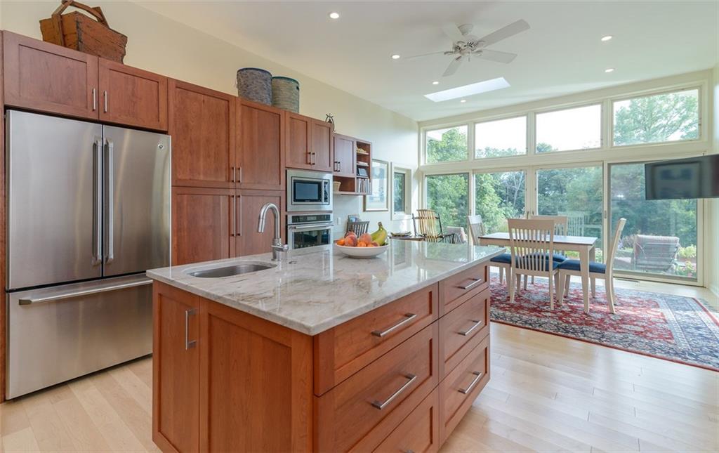 450 Backbone Road Sewickley, PA 15143 - Photo 14 of 24 Some of the many features include custom cherry cabinetry, quartz countertops, stainless high end appliances, a large center island, maple hardwood flooring, and loads of recessed lighting.