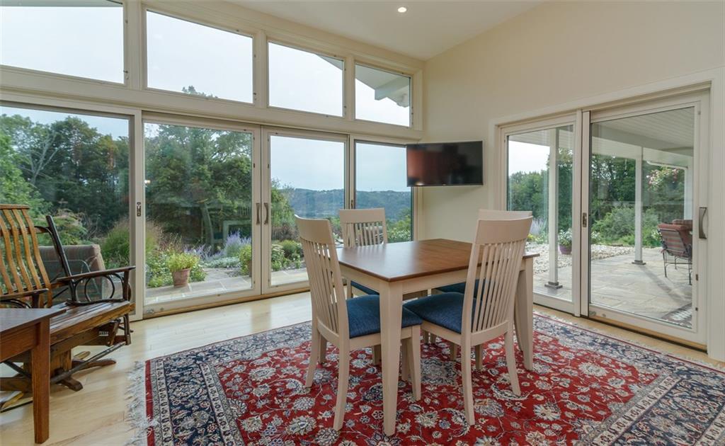 450 Backbone Road Sewickley, PA 15143 - Photo 15 of 24 The informal dining area, with a full wall of glass, has two sets of doors out to the patio for convenience.