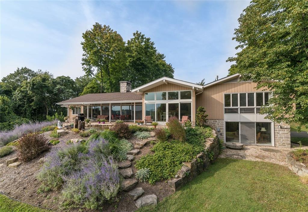 450 Backbone Road Sewickley, PA 15143 - Photo 4 of 24 The rear of the house features walls and windows of glass, that take advantage of the vistas.