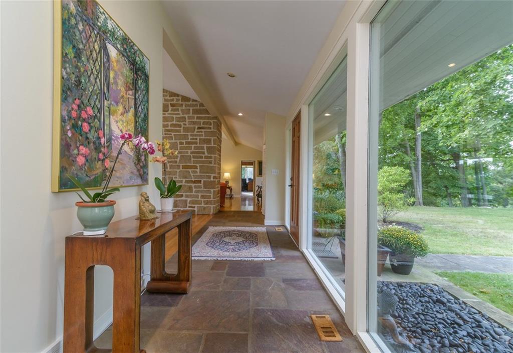 450 Backbone Road Sewickley, PA 15143 - Photo 6 of 24 The front entry has stone flooring, recessed lighting, two coat closets, and a front wall of glass.