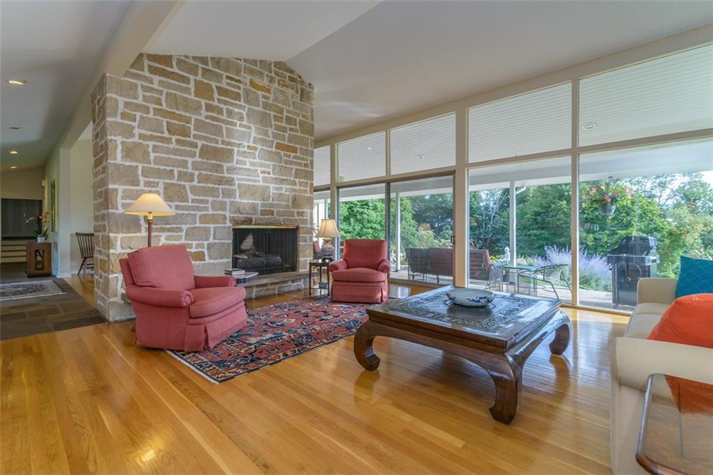 450 Backbone Road Sewickley, PA 15143 - Photo 7 of 24 The living room features a handsome stone fireplace, and offers plenty of room to have several seating groups.