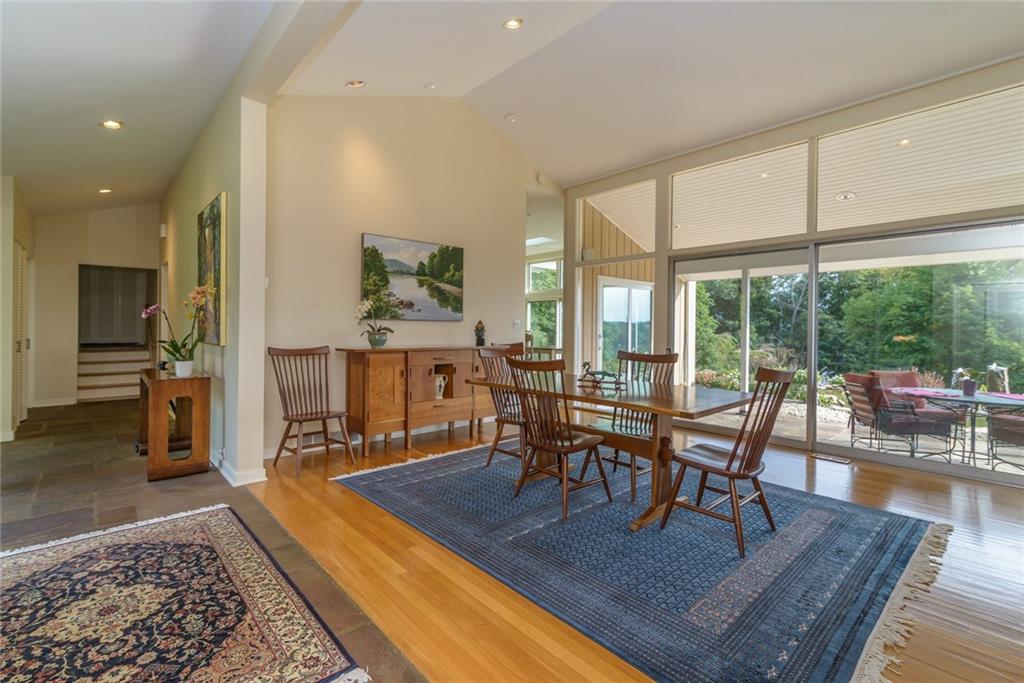 450 Backbone Road Sewickley, PA 15143 - Photo 10 of 24 A second view of the dining room area shows the high ceilings. Sliding doors open out to the patio.