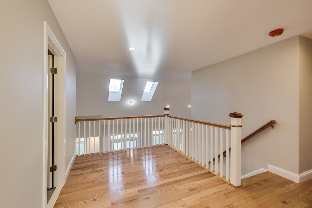 38 Cherry Street, Unit B Hudson, MA 01749 - Photo 14 of 38 a view of a hallway with staircase