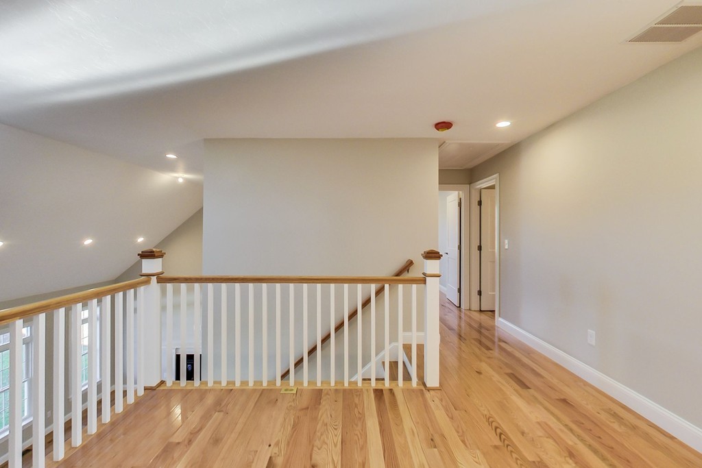 38 Cherry Street, Unit B Hudson, MA 01749 - Photo 15 of 38 a view of hallway with wooden floor