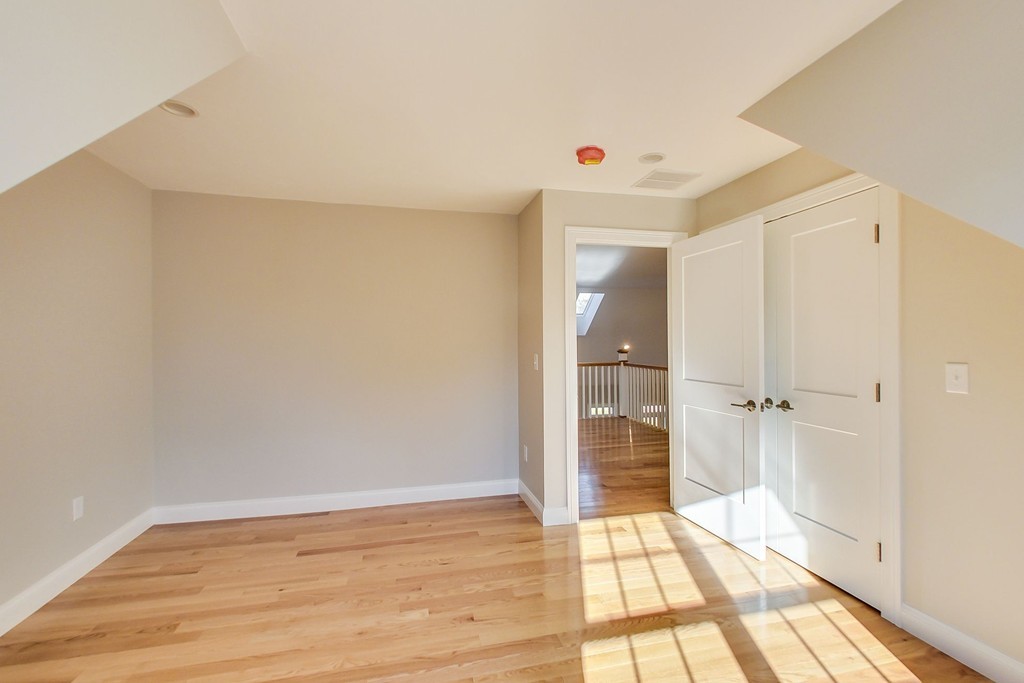 38 Cherry Street, Unit B Hudson, MA 01749 - Photo 18 of 38 a view of empty room with wooden floor