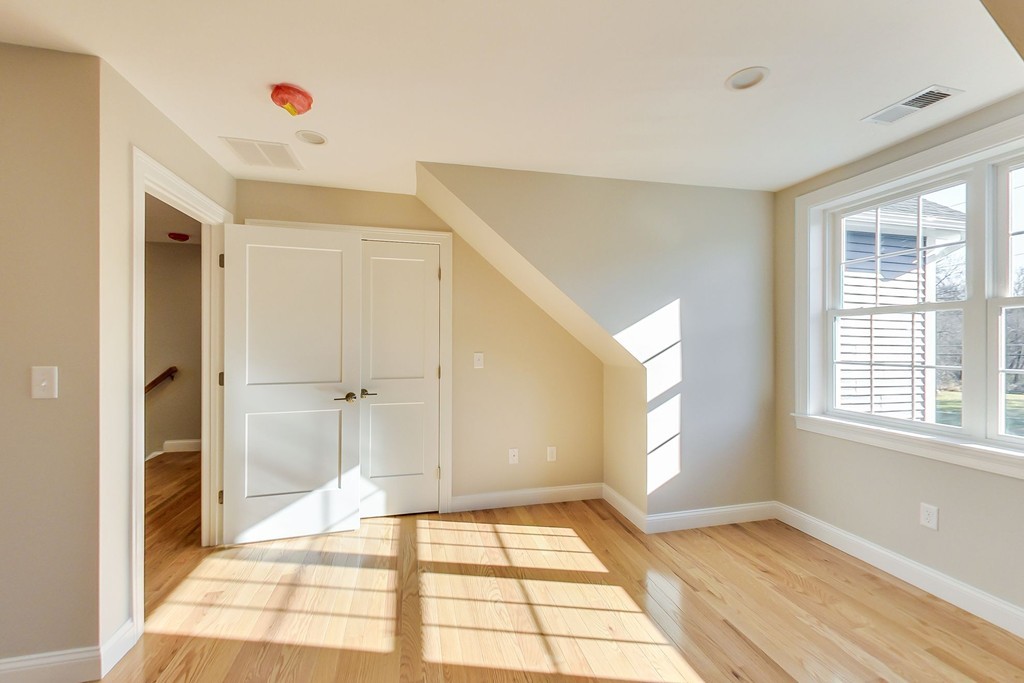 38 Cherry Street, Unit B Hudson, MA 01749 - Photo 19 of 38 a view of an empty room and window