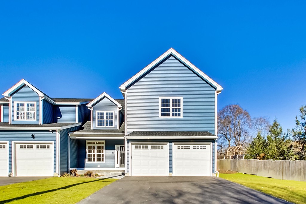 38 Cherry Street, Unit B Hudson, MA 01749 - Photo 2 of 38 a view of a house with a swimming pool