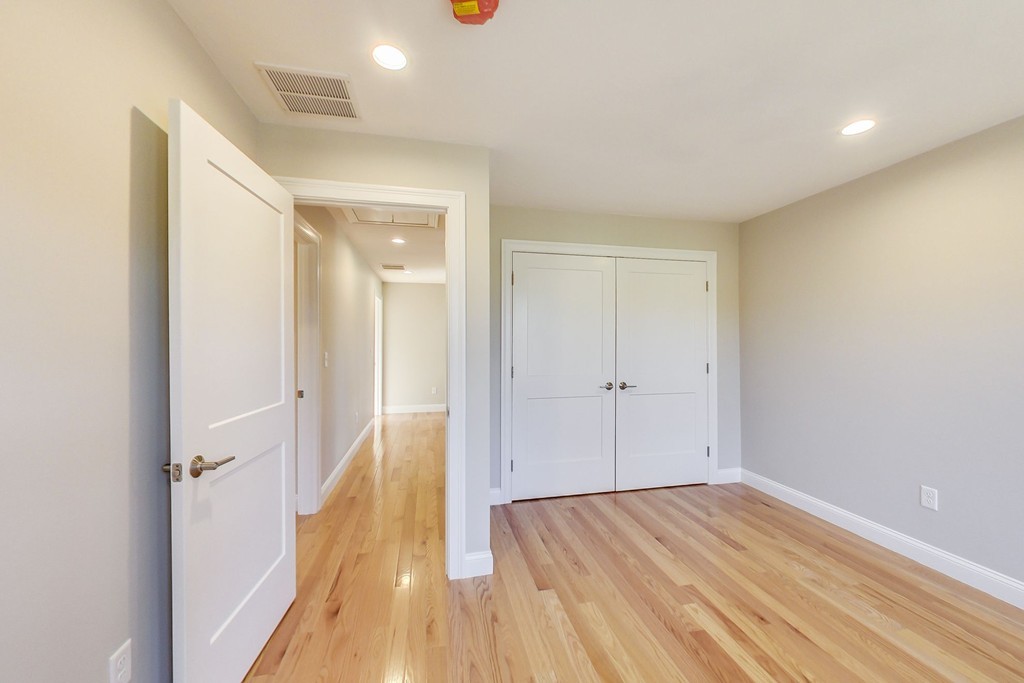 38 Cherry Street, Unit B Hudson, MA 01749 - Photo 21 of 38 a view of hallway with wooden floor