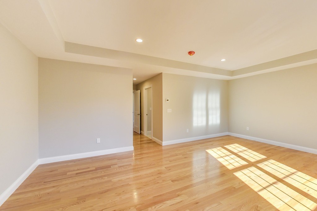 38 Cherry Street, Unit B Hudson, MA 01749 - Photo 24 of 38 a view of an empty room and window