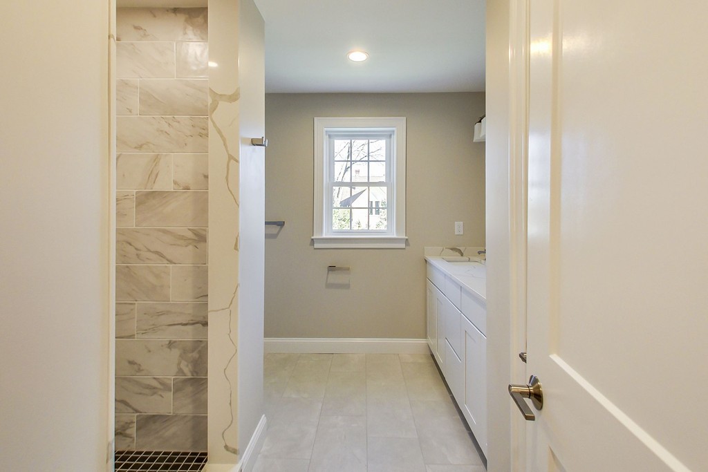 38 Cherry Street, Unit B Hudson, MA 01749 - Photo 26 of 38 a bathroom with a bathtub and shower