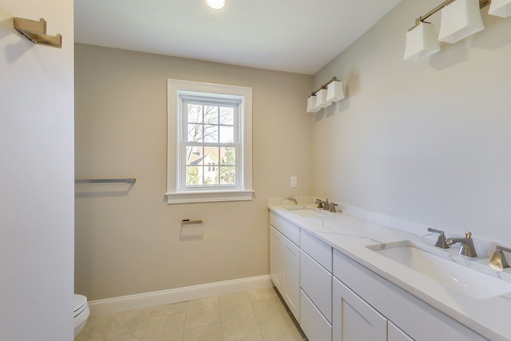 38 Cherry Street, Unit B Hudson, MA 01749 - Photo 27 of 38 a bathroom with a sink and a vanity