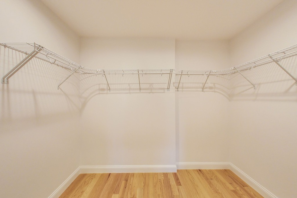 38 Cherry Street, Unit B Hudson, MA 01749 - Photo 28 of 38 a view of a room with racks on the wall