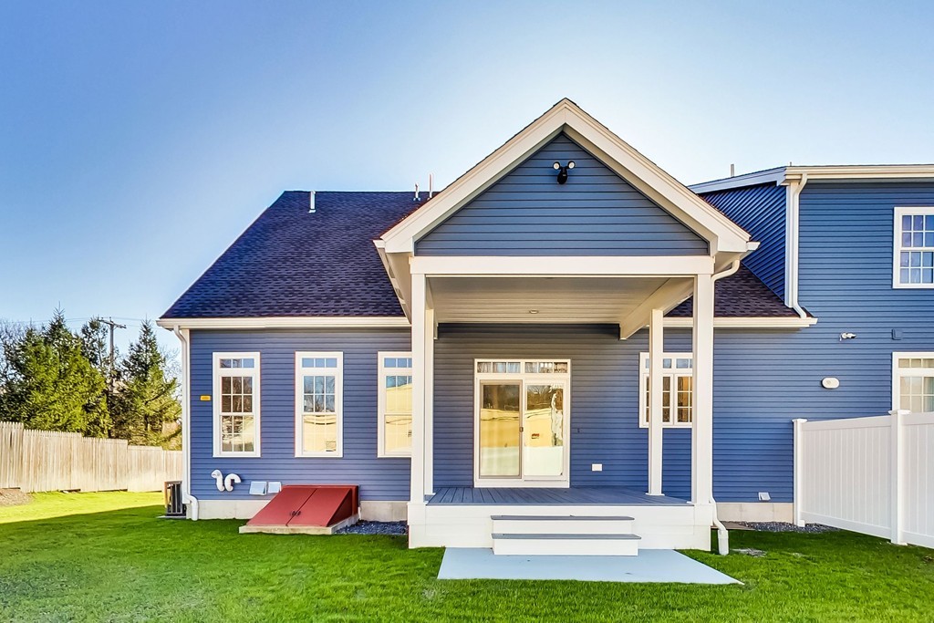 38 Cherry Street, Unit B Hudson, MA 01749 - Photo 32 of 38 a view of front of a house with a yard