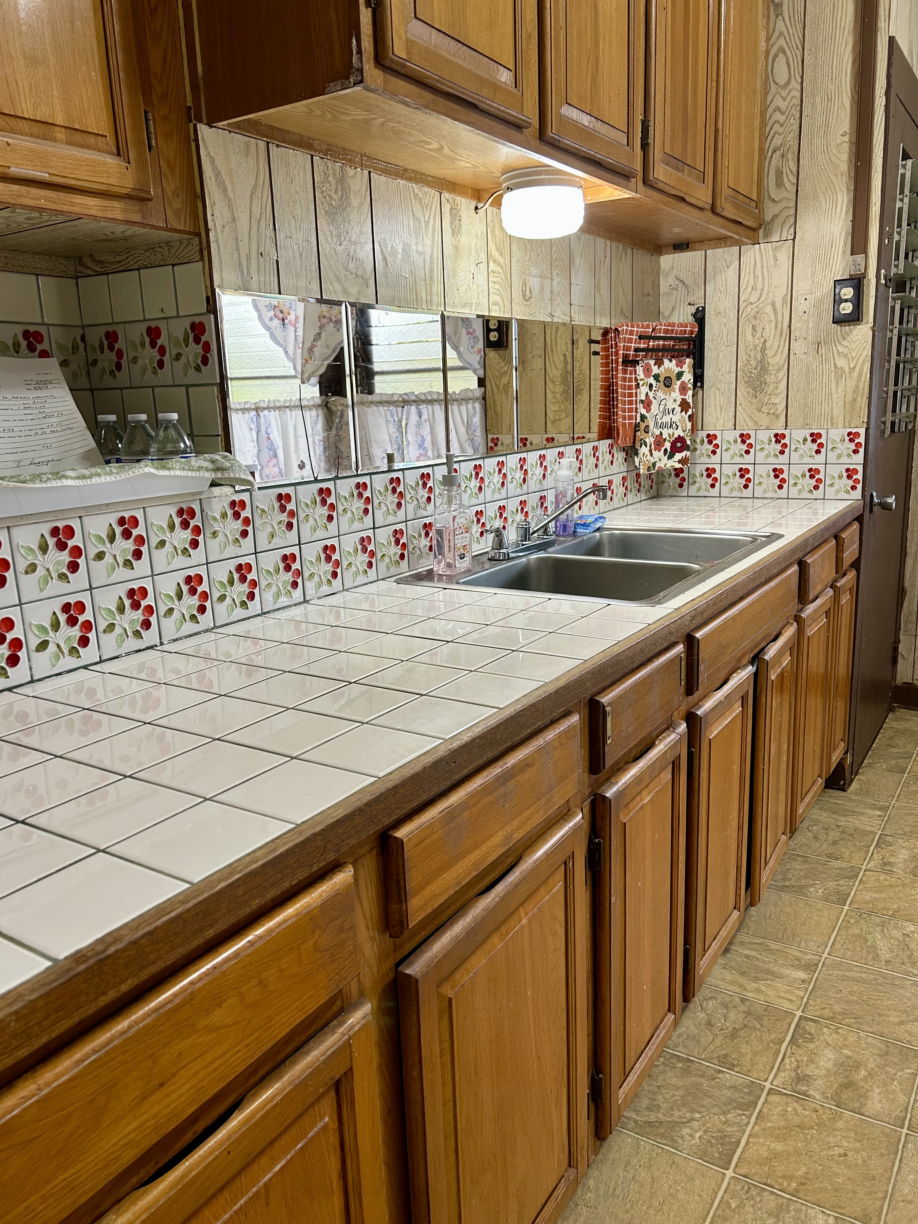 4670 Opu Road Kalaheo, HI 96741 - Photo 3 of 27 a kitchen with stainless steel appliances kitchen island granite countertop a sink and cabinets
