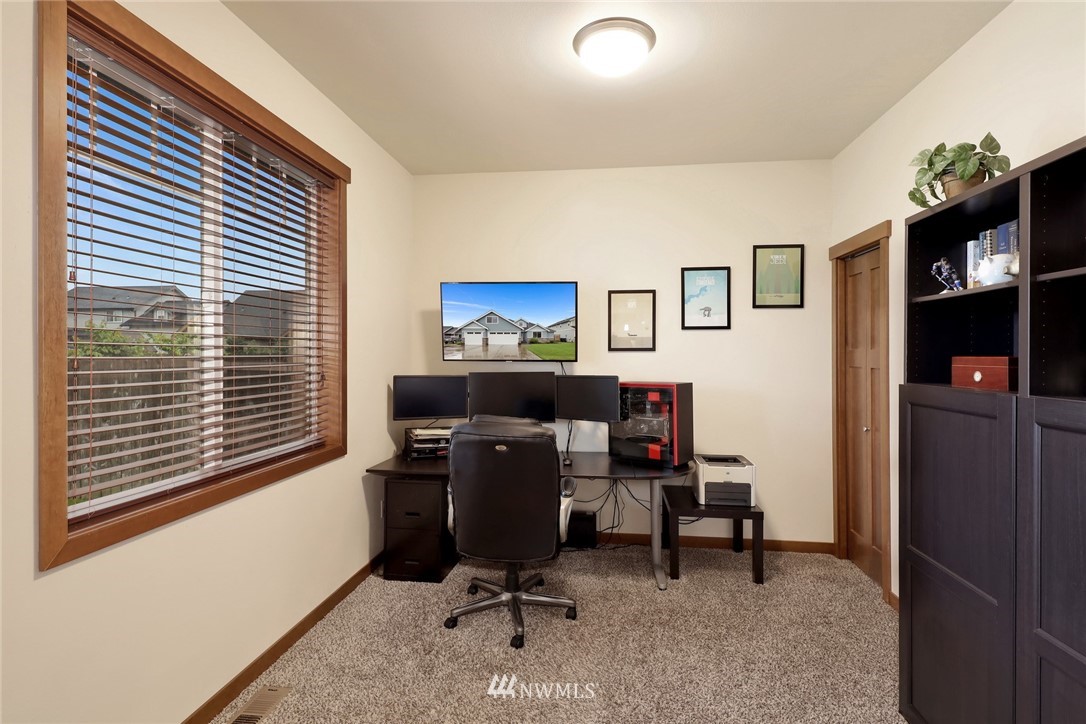 804 Red Maple Loop Everson, WA 98247 - Photo 13 of 40 a view of a workspace with furniture and a window
