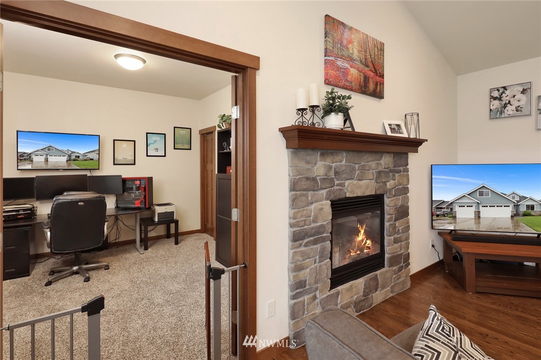 804 Red Maple Loop Everson, WA 98247 - Photo 14 of 40 a living room with furniture and a fireplace
